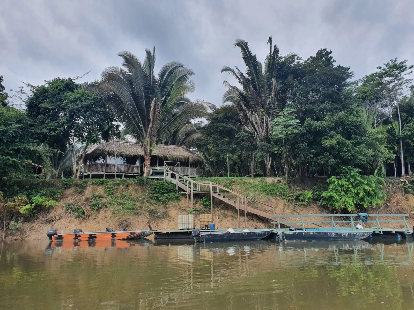 a jungle lodge and dock as seen from the Aripuana river
