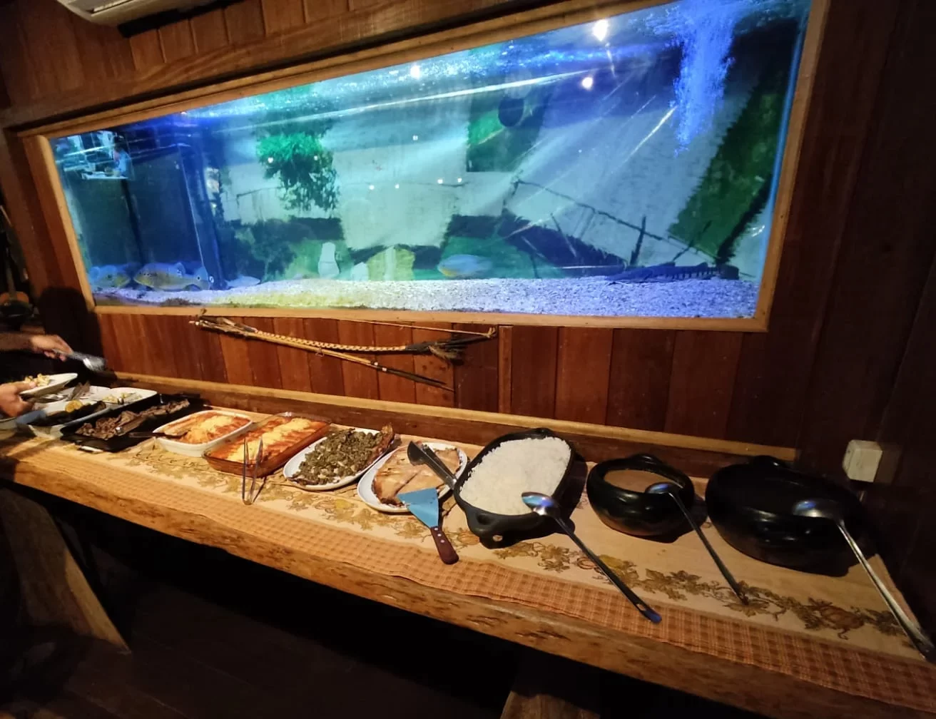 a buffet dinner set in front of an aquarium